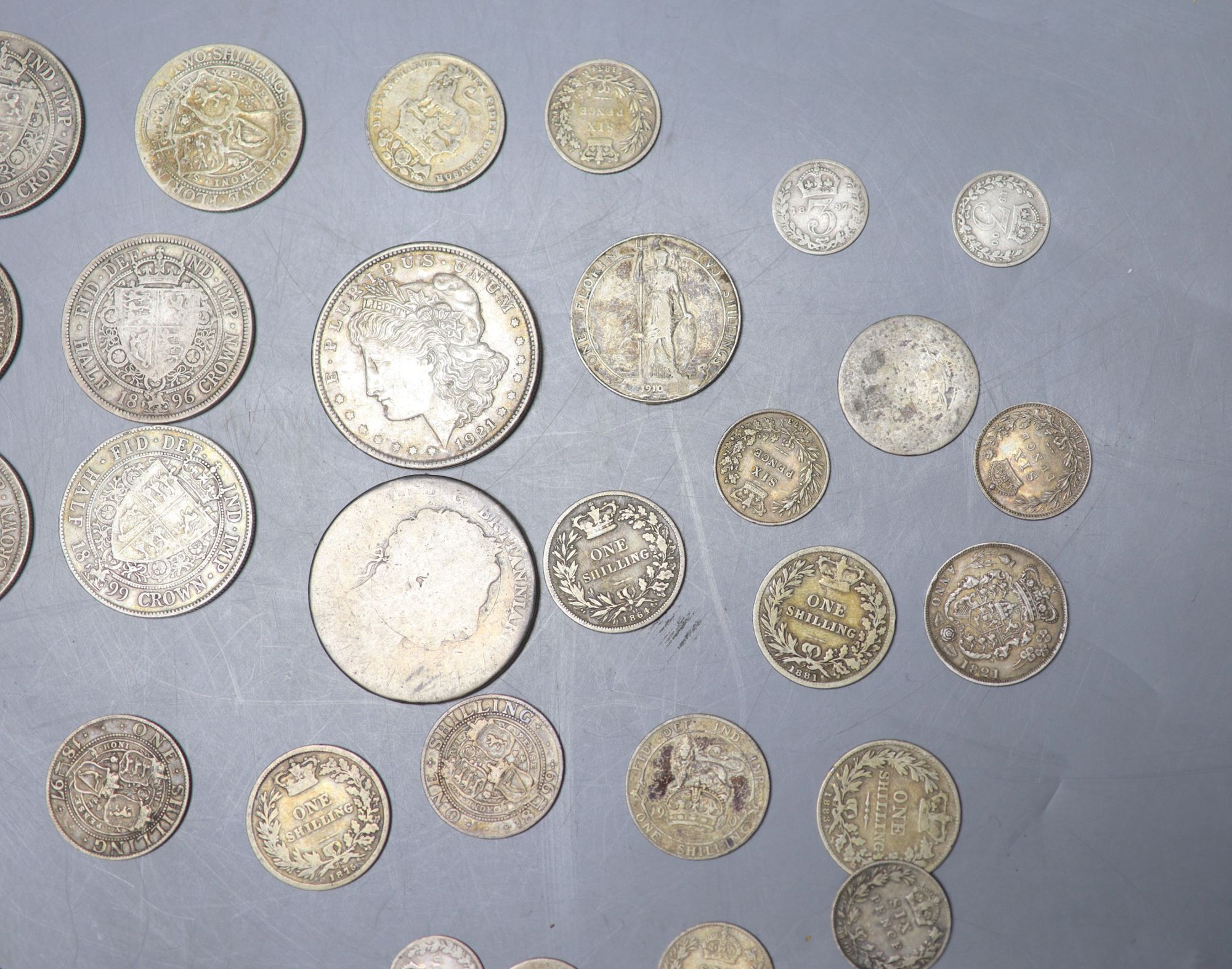 A collection of UK and world coins including George IV - George V silver threepences to halfcrowns